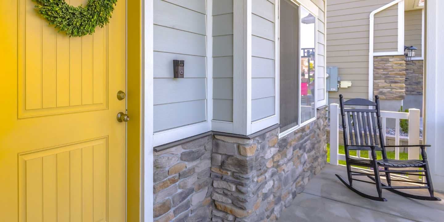 Yellow front door and porch