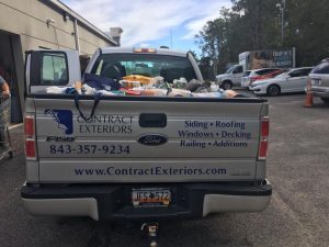 contract exteriors pickup truck with food supplies