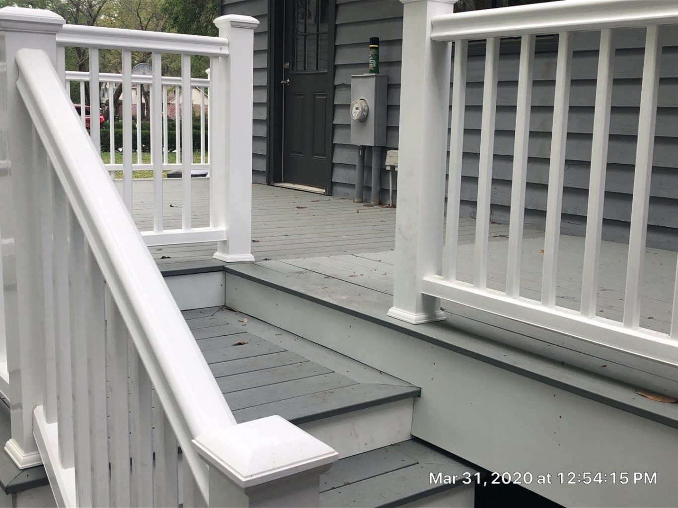 gray deck with white railing